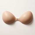 Snoothe Push-Up Sticky Bra — sand silicone cups with a brushed-brass centre clasp