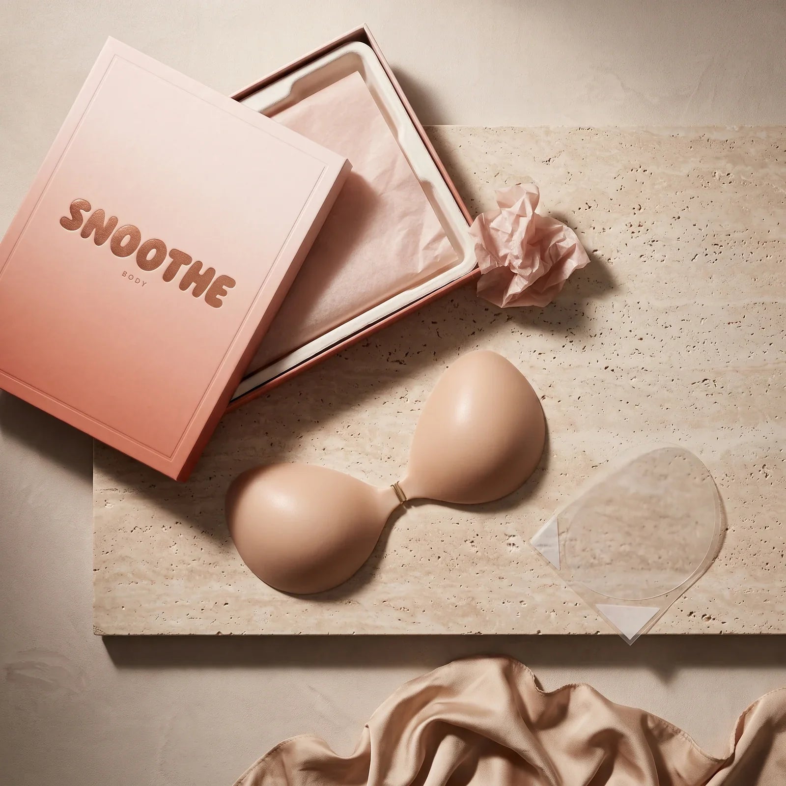 Everything in the box — bra, storage board, spare adhesive set